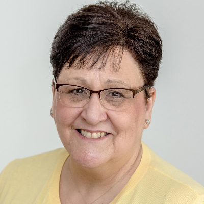 Darlene headshot smiling at camera.